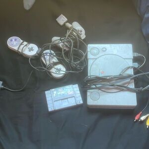 Playstation with controllers and mortal combat 3
